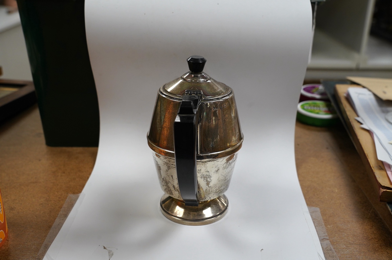 A George V Art Deco silver coffee pot, A L Davenport Ltd, Birmingham, 1932, height 16.9cm, gross weight 10.8oz. Condition - fair